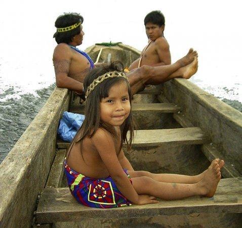 Embera in canoe